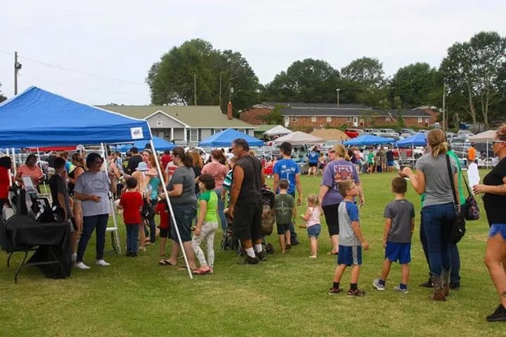 Families gathered on the field at the C.A.N. back-to-school community day